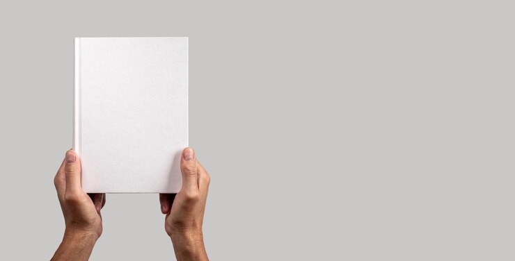 Photo paper book mockup in men hand on gray banner with copy space hardcover mockup blank empty template presentation