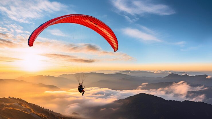 Paraglider flies in the beautiful sky