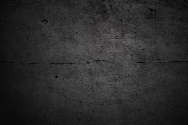 Pareti incrinate Il pavimento in cemento grigio scuro è invecchiato in un concetto retrò Texture di un muro di cemento nero grungy come sfondo