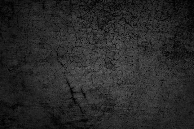 Pareti incrinate Il pavimento in cemento grigio scuro è invecchiato in un concetto retrò Texture di un muro di cemento nero grungy come sfondo