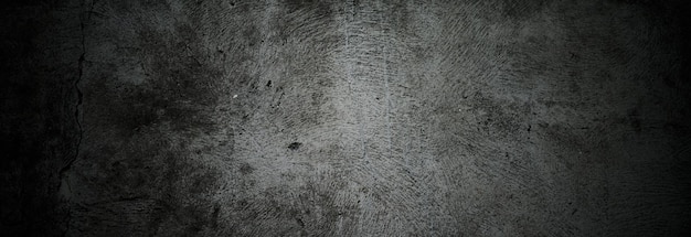 Pareti scure spaventose leggermente struttura in cemento nero chiaro per lo sfondo Spazzola graffi sul muro