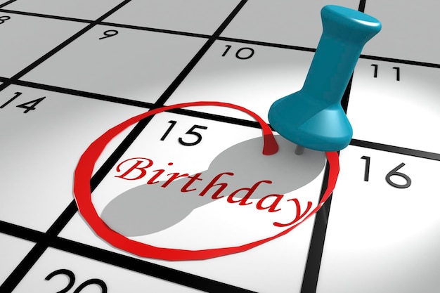 Parola di compleanno segnata sul calendario con puntina