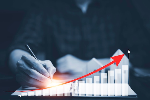 Perdite aziendali sul grafico del mercato azionario Il grafico del mercato della linea di tocco della penna per uso aziendale e le frecce rosse cadono a terra indicando la recessione economica che si verificherà nel 2022