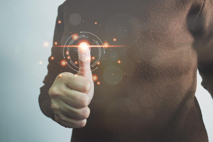 Person touching screen to fingerprint scanner security access information