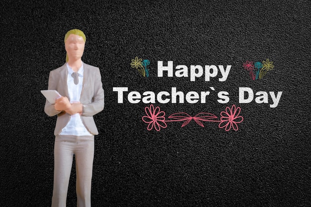 Persone in miniatura Insegnante davanti alla lavagna, concetto della Giornata mondiale dell'insegnante
