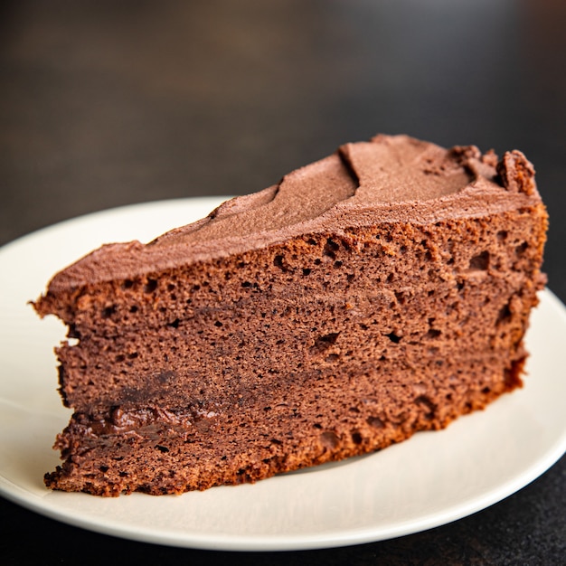 pezzo di torta al cioccolato cacao vacanza trattare pan di spagna crema marrone dolce dessert pasto spuntino