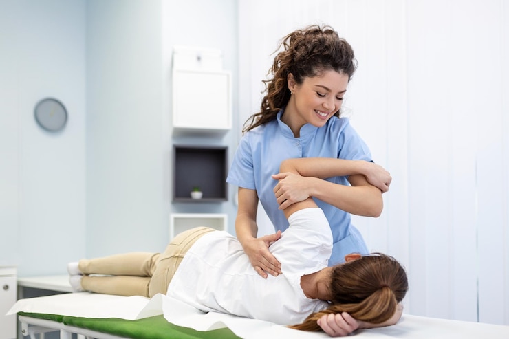 Physiotherapist treatment patient Holding patient's hand shoulder joint treatment Physical Doctor consulting with patient About Shoulder muscule pain problems Physical therapy diagnosing concept