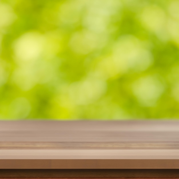 piano del tavolo in legno con sfondo verde sfocato