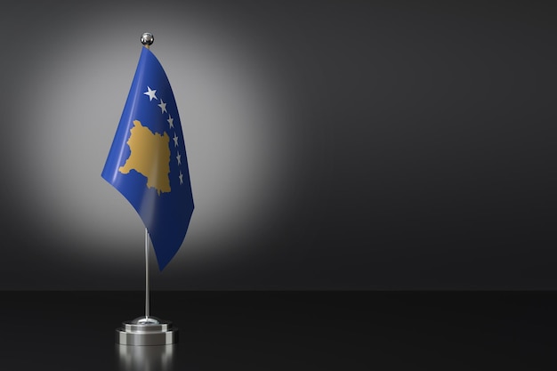 Piccola bandiera nazionale del Kosovo su uno sfondo nero 3d Rendering