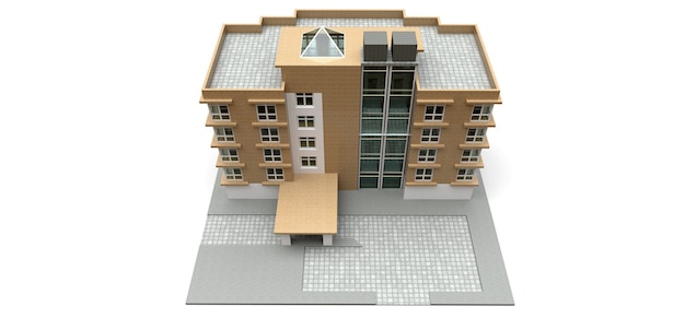 Piccolo condominio bianco e beige con ascensore e garage. rendering 3D.