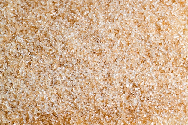 Pila di zucchero di canna texture sfondo vista dall'alto e disposizione piatta Zucchero di canna naturale