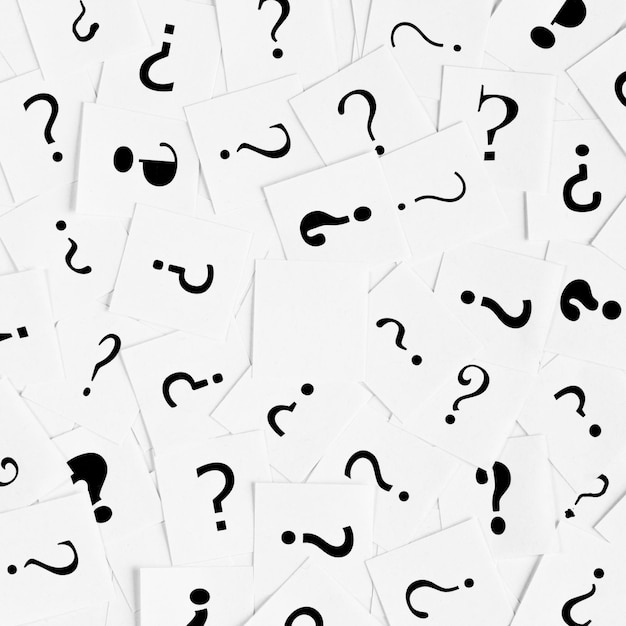 pile of question mark signs scattered around as a square background. decision, enquiry or faq concept.