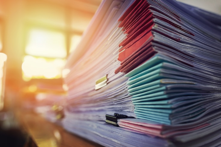 Photo pile of unfinished a bundle documents on office desk, stack of business paper