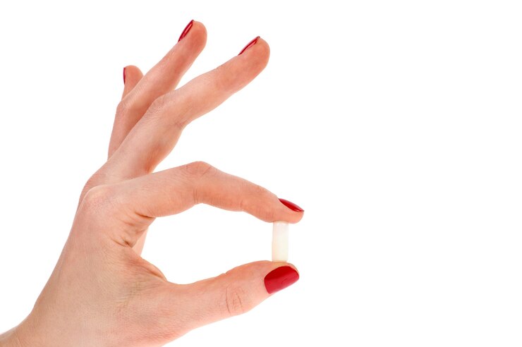 Pillole in mano della donna