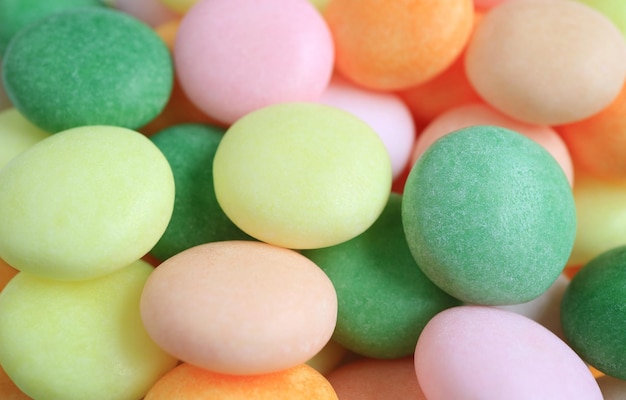 Pilo di caramelle di forma rotonda di colore pastello e fruttato per sfondo e carta da parati