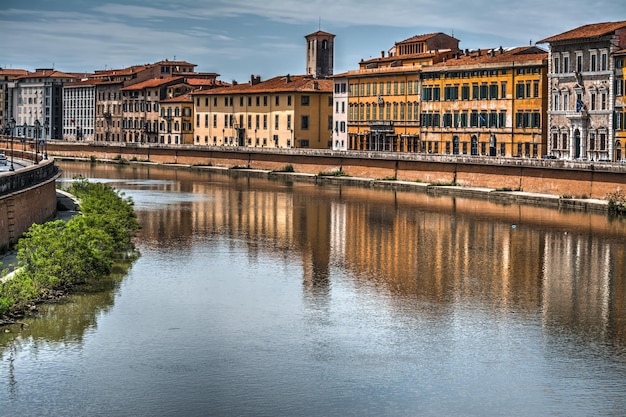 Pisa lungarno sotto un cielo drammatico Italia