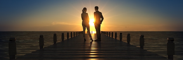 Ponte di legno in un tramonto con il rendering 3d dell'uomo d'affari