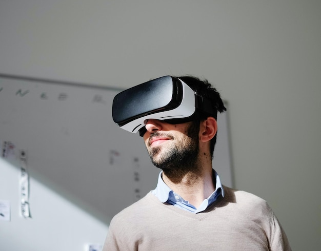 portrait of man wearing virtual reality glasses