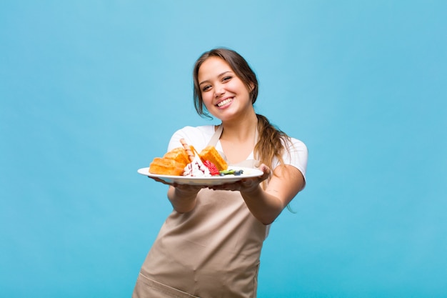 Pretty woman in baker uniforme