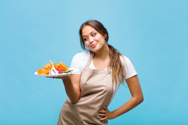 Pretty woman in baker uniforme