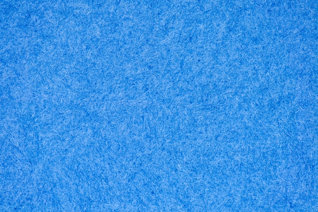Primo piano altamente dettagliato della struttura di carta pastello ruvida azzurro chiaro