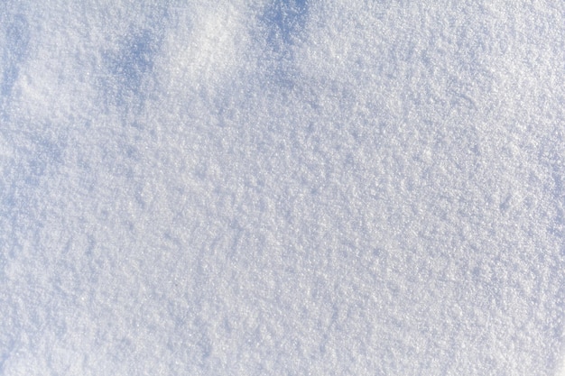 Primo piano bianco pulito della neve Sfondo invernale Superficie della neve Trama di neve bianca e soffice fresca