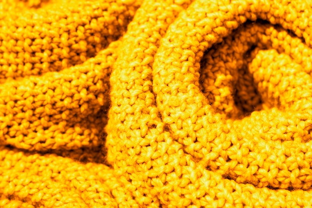 Primo piano d'avanguardia del tessuto a maglia di lana di colore giallo Ceylon, struttura, fondo