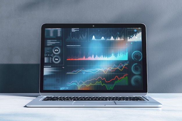 Primo piano del laptop con ologramma grafico aziendale digitale su sfondo blu sfocato Finanza commerciale e concetto di analisi Doppia esposizione