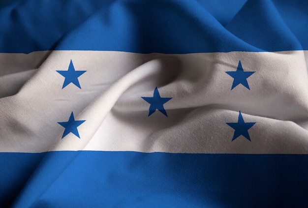 Primo piano della bandiera arruffata dell&#39;Honduras, bandiera dell&#39;Honduras che soffia in vento