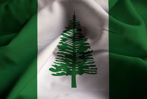 Primo piano della bandiera arruffata della Norfolk Island, bandiera della Norfolk Island che soffia in vento