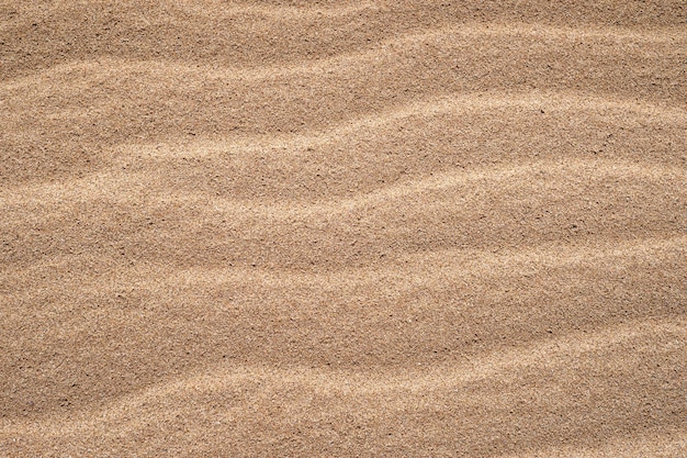 Primo piano di sabbia sulla spiaggia utilizzando come sfondo