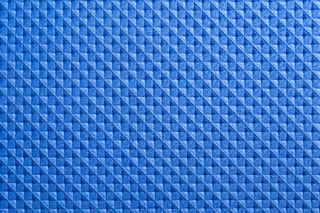 Primo piano di struttura quadrata di gomma blu astratta