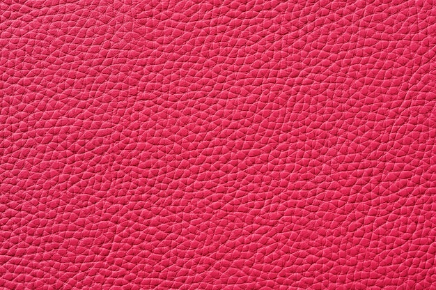 Primo piano di texture in pelle rosa senza cuciture per lo sfondo