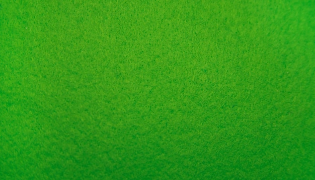 Primo piano in tessuto di feltro verde Sfondo astratto La trama delle fibre Superficie in velluto