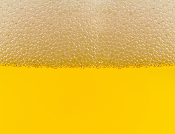 Foto priorità bassa astratta di struttura della birra