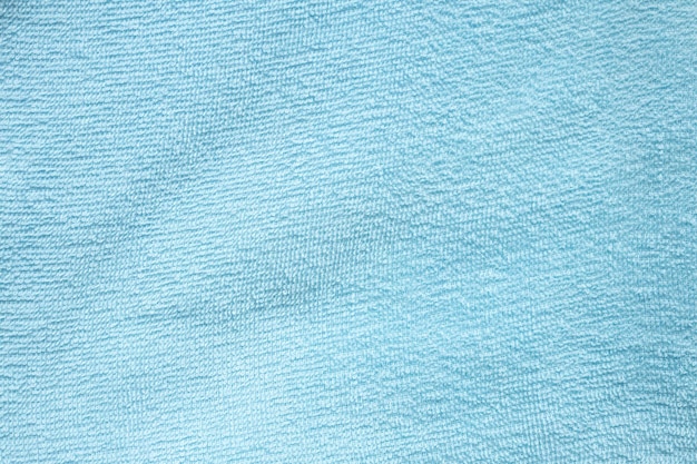 Priorità bassa dell'estratto di struttura dell'asciugamano del tessuto di cotone blu
