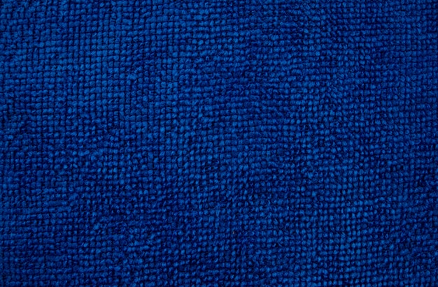 Priorità bassa di struttura di lana a maglia a mano. Classico colore blu Pantone dell'anno 2020