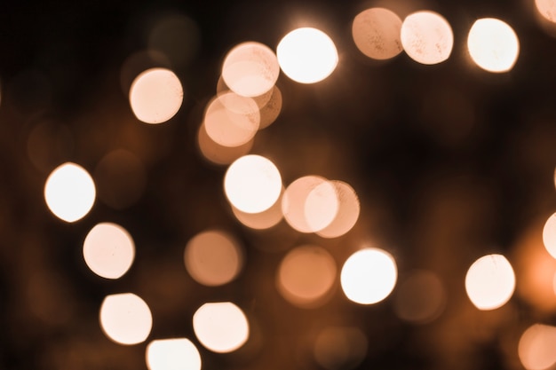 Priorità bassa festiva con punti luce e bokeh