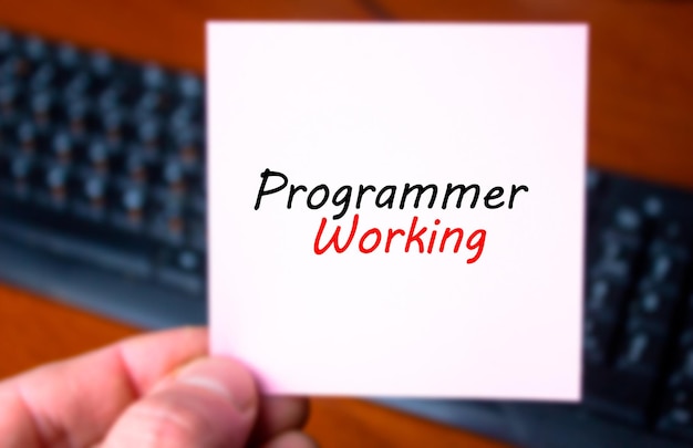 PROGRAMMATORE Lavoro iscrizione di testo a mano sfondo tastiera del computer Programmatore sviluppatore vac