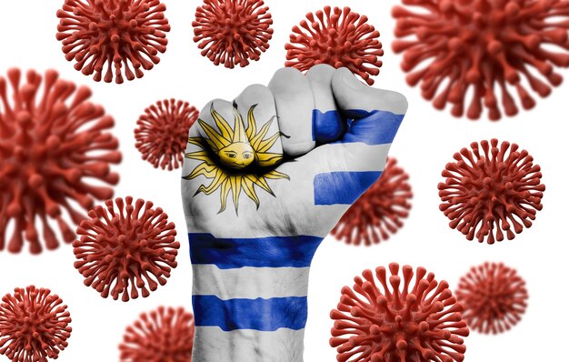 Pugno della bandiera dell'Uruguay che combatte la malattia di coronavius