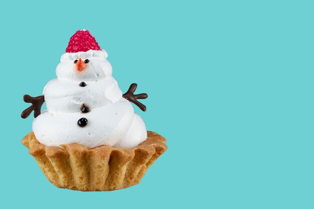 Pupazzo di neve Cupcake Torta di Natale su sfondo blu