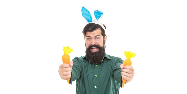 Quale vuoi hipster che indossa le orecchie di coniglio tempo per il divertimento ragazzo allegro che tiene le carote vacanze di primavera saluto marea di pasqua felice uomo barbuto indossare orecchie da coniglio buona pasqua carota di pasqua