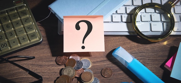 Question mark on sticky note with a business objects