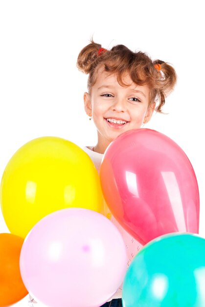 Ragazza che ride con palloncini colorati