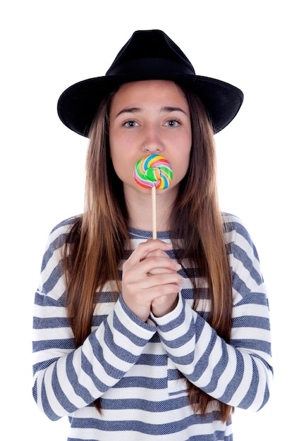 Ragazza dell&#39;adolescente con una lecca-lecca colorata sulla sua bocca