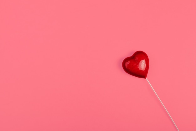 Red heart on color , minimal concept,