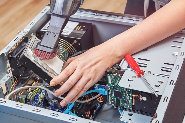 Photo remove dust from hard disk drive of desktop pc using vacuum cleaner
