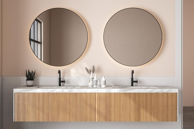 Rendering 3D primo piano di una moderna unità di vanità in bagno con specchi rotondi su doppio lavabo in marmo piastrelle bianche quadrate e pareti beige Morning Sunlight Prodotti display sfondo Mock up