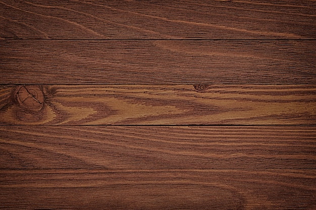 Reticolo dello sfondo naturale di una vecchia parete di legno della capanna di tronchi. Tronchi di legno stagionati con fondo di lerciume del modello naturale.