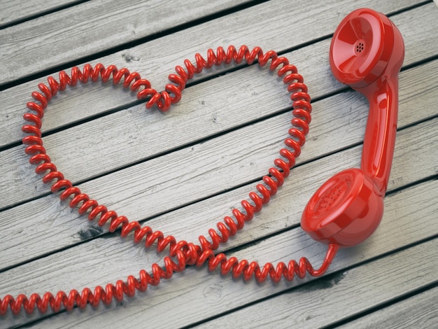 Ricevitore telefonico e cavo come cuore su sfondo bianco in legno Amore hotline concetto 3d